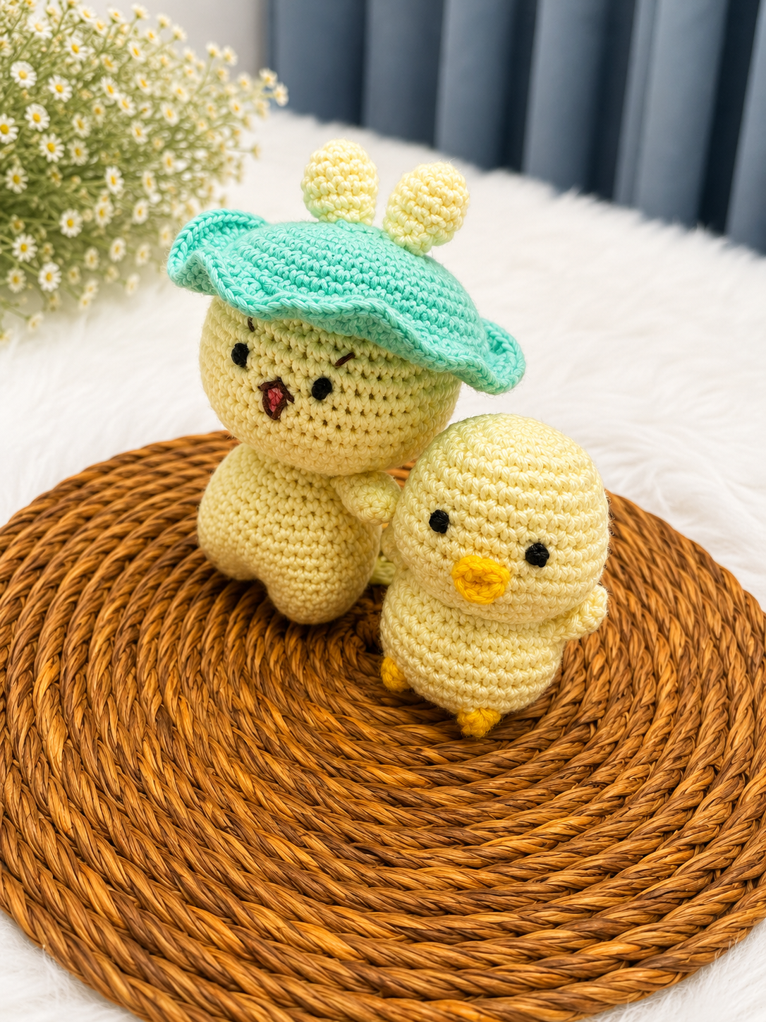 Mama & Peep Crochet Chick Duo – handmade mother and daughter chick plush set crafted from soft cotton yarn, displayed on a woven mat by The Hook Project.