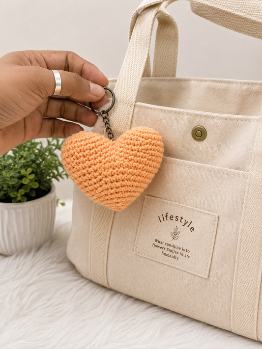 Handcrafted peach crochet heart keychain with metal keyring, handmade cotton yarn accessory by The Hook Project