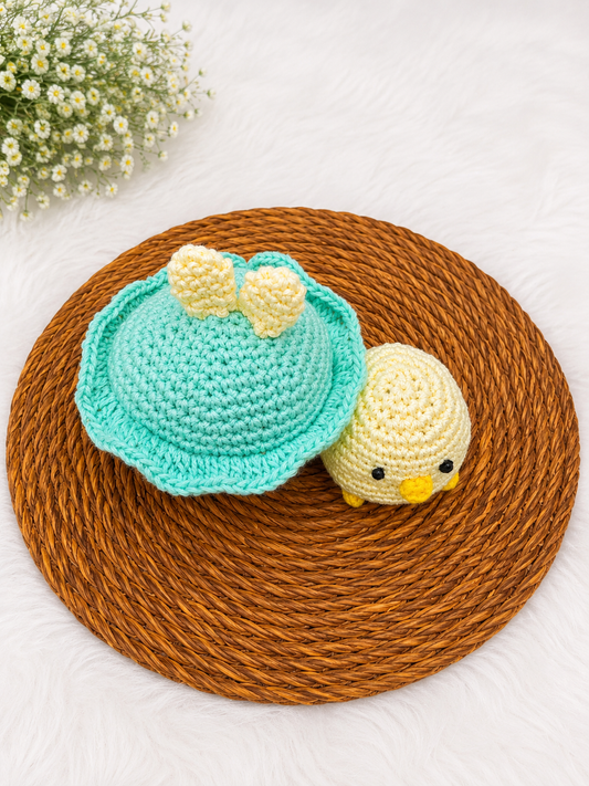 Mama & Peep Crochet Chick Duo – handmade mother and daughter chick plush set crafted from soft cotton yarn, displayed on a woven mat by The Hook Project.