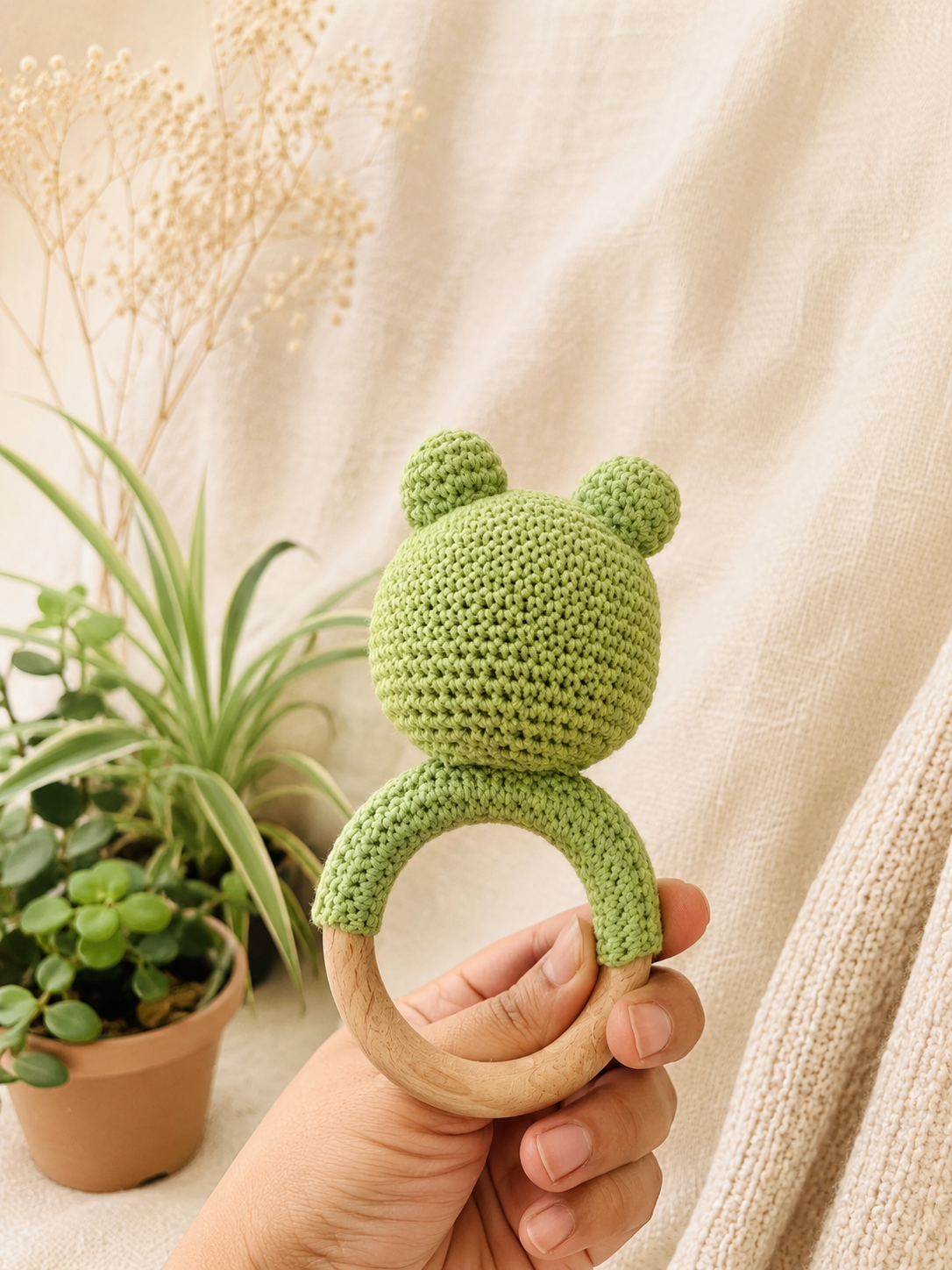 Finn the crochet frog wooden teether and rattle handmade baby toy by The Hook Project