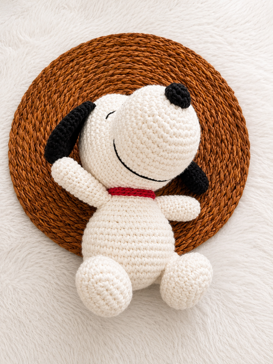 Handmade crochet Snoopy-inspired plush toy crafted with premium white cotton yarn, black ears, and a red collar.