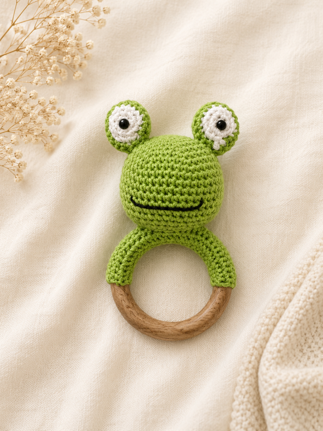 Finn the crochet frog wooden teether and rattle handmade baby toy by The Hook Project