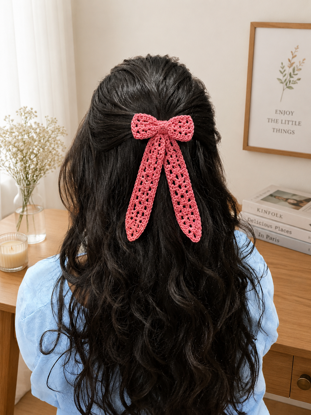 Handmade pink crochet bow hair clip attached to secure metal tic tac clips, crafted with premium cotton yarn by The Hook Project.