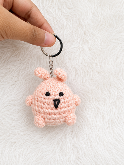 Handcrafted crochet chick keychain in pink and blush cotton yarn with metal keyring, handmade character accessory by The Hook Project