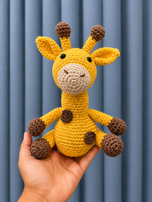 Handmade Sunny Crochet Giraffe amigurumi plush toy held in hand, crafted with premium cotton yarn and detailed crochet stitching.