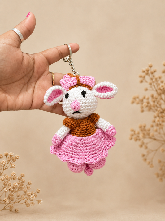 Handcrafted crochet mouse keychain with pink bow and skirt, handmade cotton yarn accessory by The Hook Project