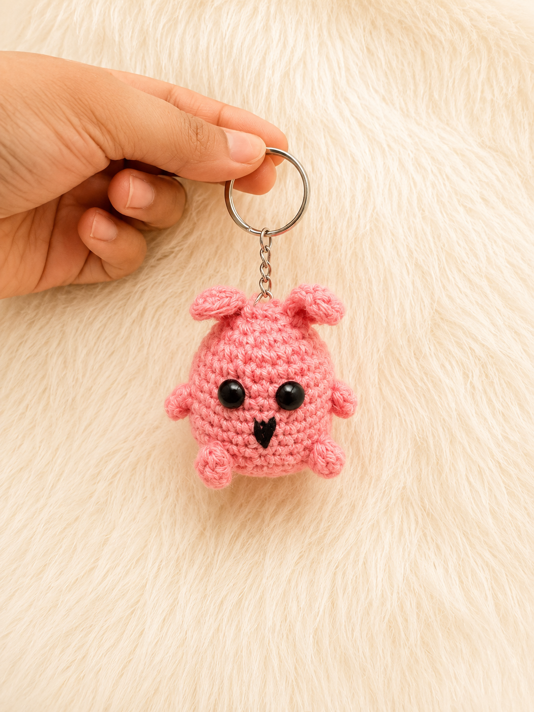 Handcrafted crochet chick keychain in pink and blush cotton yarn with metal keyring, handmade character accessory by The Hook Project