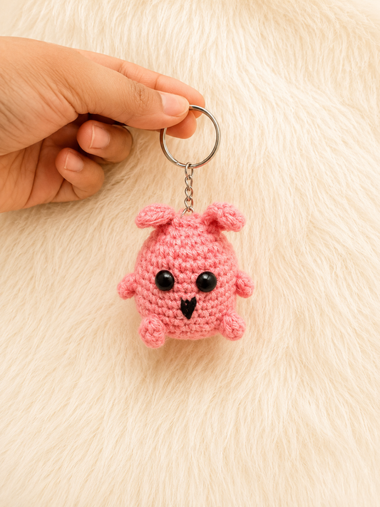 Handcrafted crochet chick keychain in pink and blush cotton yarn with metal keyring, handmade character accessory by The Hook Project