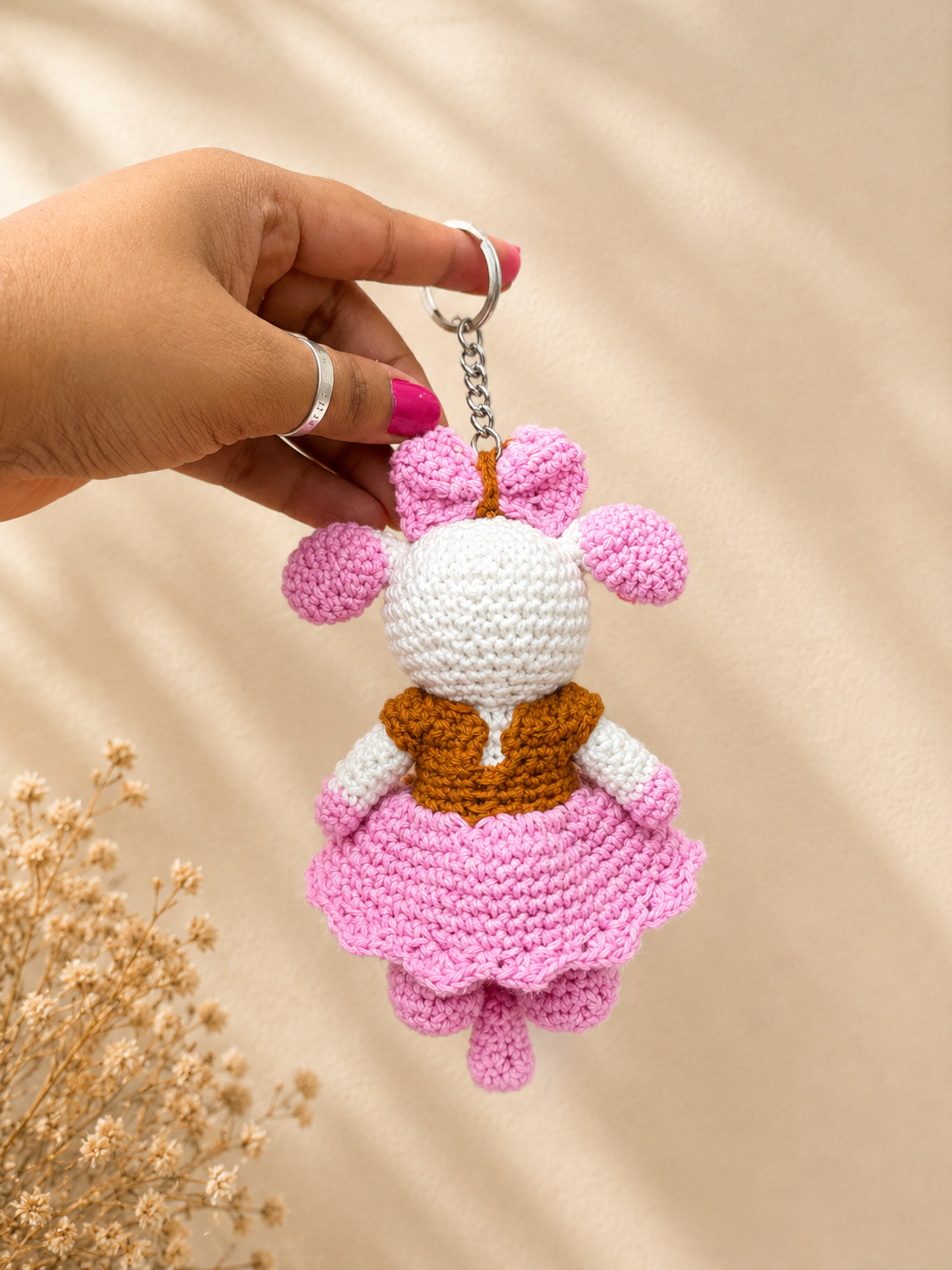 Handcrafted crochet mouse keychain with pink bow and skirt, handmade cotton yarn accessory by The Hook Project