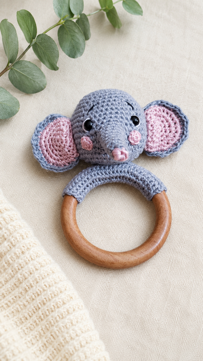 Handmade grey crochet elephant teether attached to a natural wooden ring, crafted with premium cotton yarn for babies by The Hook Project.