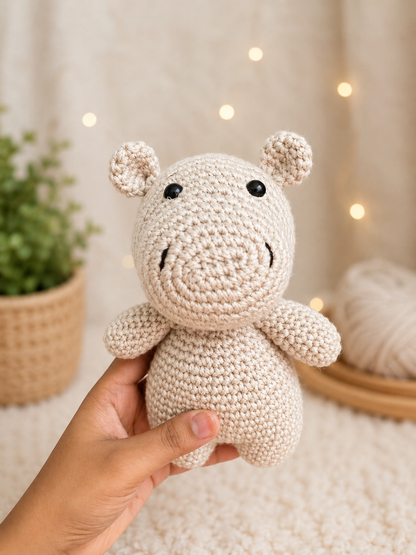 Hazel the Crochet Hippo handmade amigurumi plush toy crafted from soft cream cotton yarn with a sweet smile, tiny ears, and adorable handcrafted detailing.